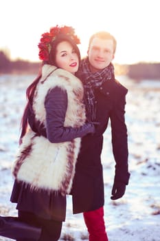 Healthy walk in winter on the frozen field covered with snow