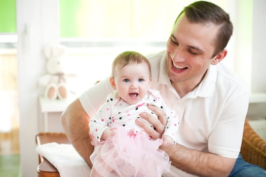 Father and his baby dauther in ballet dancer dress