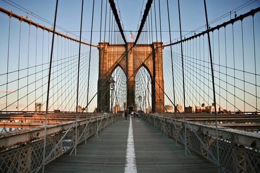 Local people and tourists walking Brooklyn bridge