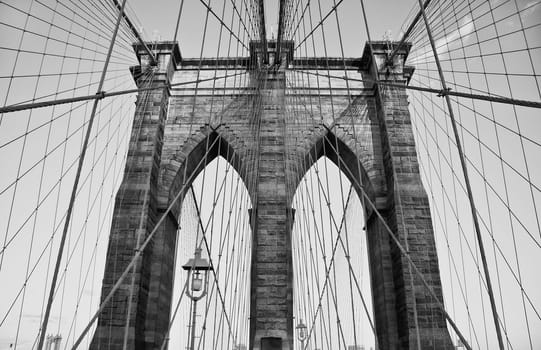 The Brooklyn Bridge is one of the oldest suspension bridges in the United States. Black and white shot
