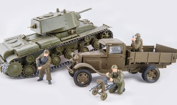 Installation of combat with children's toys on a white background
