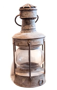 Old oil lamp on the white background