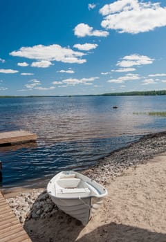 Wooden white boan on the lake in Finlandwhite, white boat