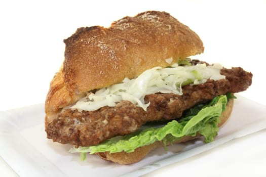 a bun with minced steak,white cabbage salad and salad