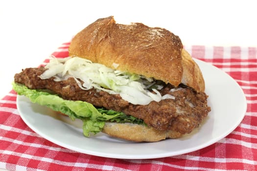 a bun with minced steak,white cabbage salad and salad