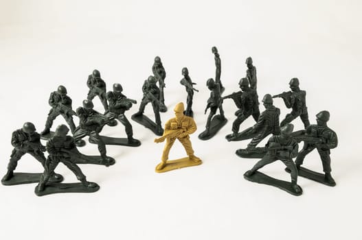 Plastic Lead Soldiers Representing War on a White Background