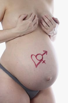 Details of a belly during pregnancy isolated on white background.