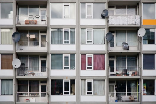 Satellite tv dishes on a concrete apartment in Overvecht, Utrecht, the Netherlands.