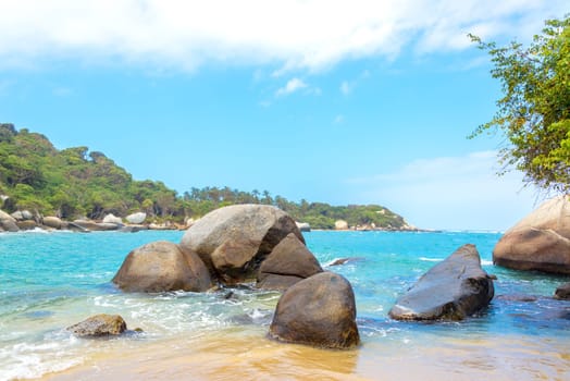 Beautiful blue Caribbean Sea and rocks in Tayrona National Park in Colombia