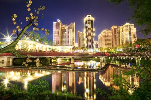 sakura with nice lake with building reflection