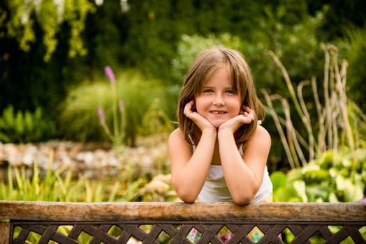 Lifestyle child portrait - little girl  outdoor in backyard