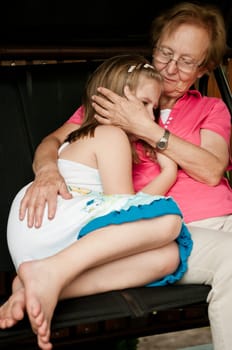 Worried girl - grandparent comforting her grandchild