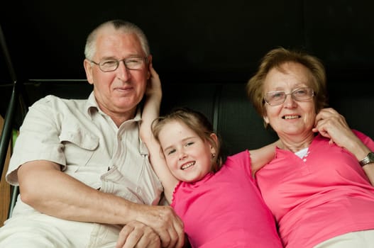 Happy retirement - grandparents with grandchild