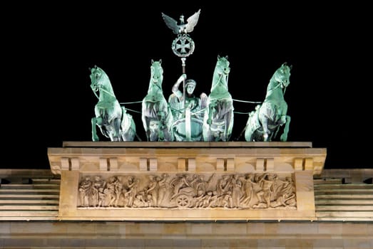 Brandenburg Gate detail at night, a former city gate and one of the main symbols of Berlin, Germany