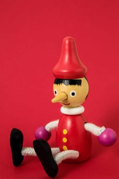 Pinocchio Toy Statue on a Colored Background