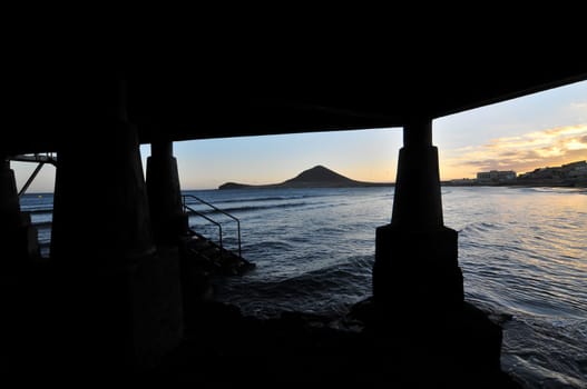 Sunset on the Atlantic Ocean with a Mountain in Background El Medano Tenerife Canary Islands Spain