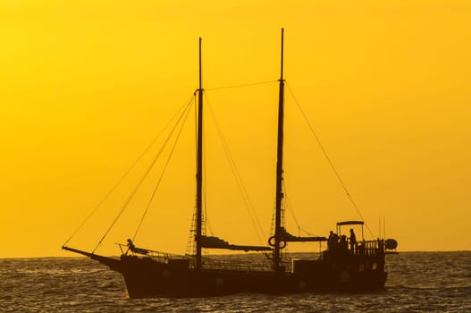 Antique Vintage Sail Vessel on the Ocean at Sunset