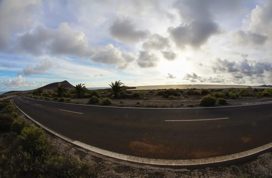 Long Empty Desert Road on a Cludy Day