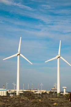 Eletric Power Generator Wind Turbine over a Cloudy Sky