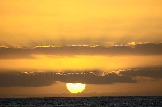 Big Orange Hard Sun at Sunset in the Ocean Canary Island Spain