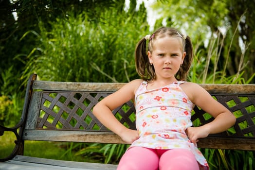 Portrait of small offended child - outoor in backyard