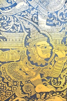 Traditional Thai style art gold painting pattern on the door in Temple Bangkok, Thailand