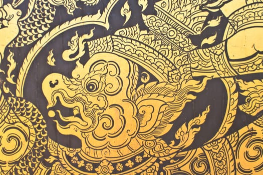 Traditional Thai style art gold painting pattern on the door in Temple Bangkok, Thailand