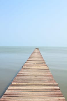 Wooden bridge into the sea, summer in Thailand