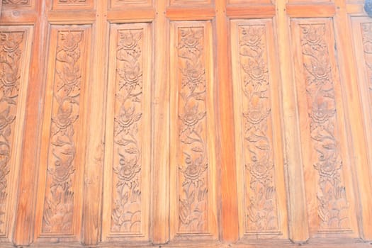 Traditional Thai style art of carving on wooden wall