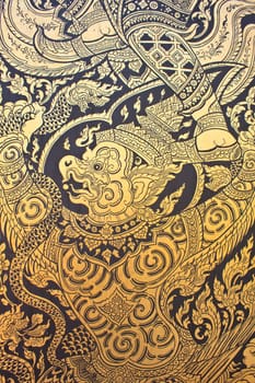 Traditional Thai style art gold painting pattern on the door in Temple Bangkok, Thailand