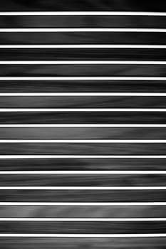 The photograph of a modern,black and white striped wood paneling.