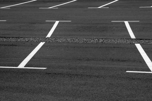 The photograph of a parking lot with parking spaces