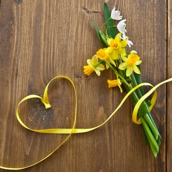 Rustic background with spring flowers and grasses