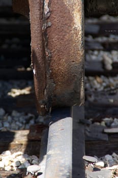 close up of a train wheel on the train track.