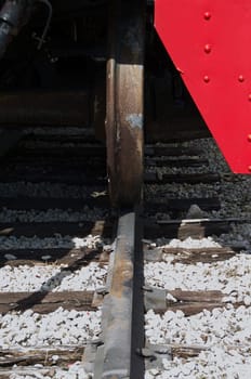 close up of a train wheel on the train track.