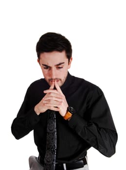 A young man in a black shirt and red tie with his fingers on his chin, thinking,.for white background..
