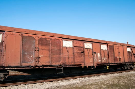 Obsolete wooden cargo railway wagon in perspective view