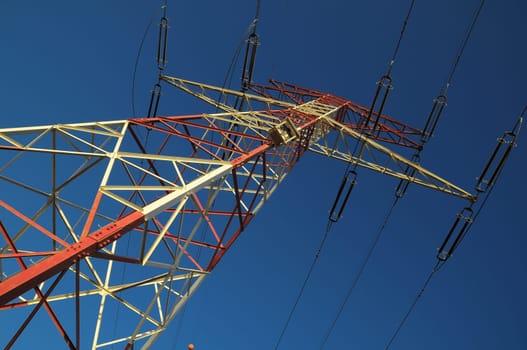 Electric Power Line Pylon over a colored Sunset