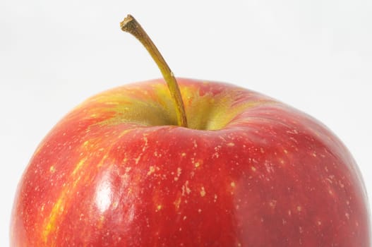 One Juicy Hot Red Apple over a White Background