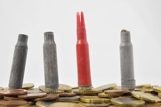 Currency Weapons Concept Bullet and coins on a White Background
