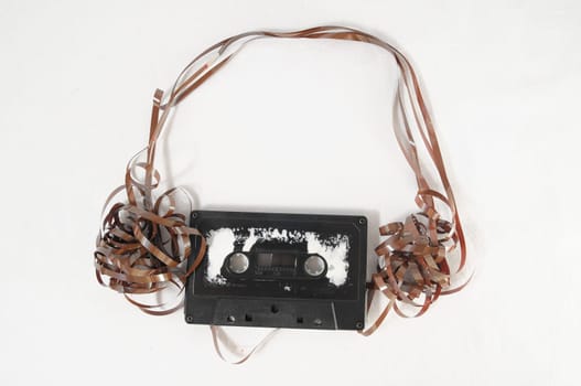 Ancient Vintage Used Musicassette over a White Background
