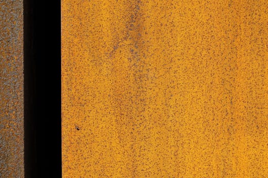 Orange Patterns on Rusty Surface of the Metal