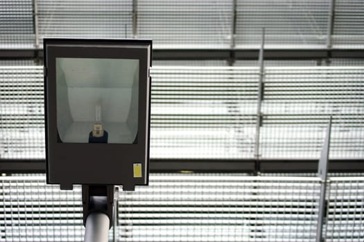 The photograph of a street lamp against a grid-like background.