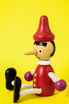 Pinocchio Toy Statue on a Colored Background