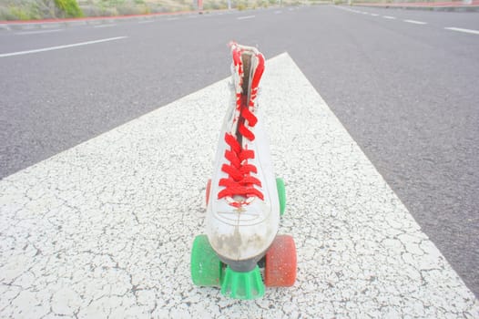 Hdr Picture of Old Vintage White Skate Boot on the Asphalt Sterret
