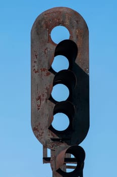 Empty railway traffic light cover box on blue sky background