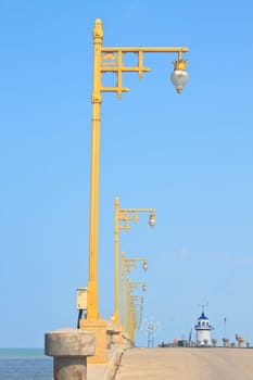 Old public pier and light pole on Southern of Thailand