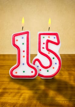 Burning birthday candles number 15