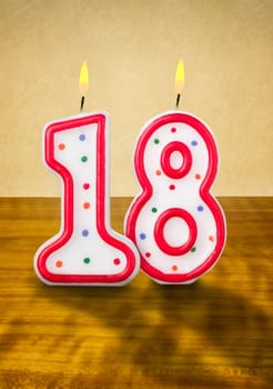 Burning birthday candles number 18