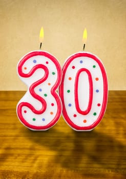 Burning birthday candles number 30